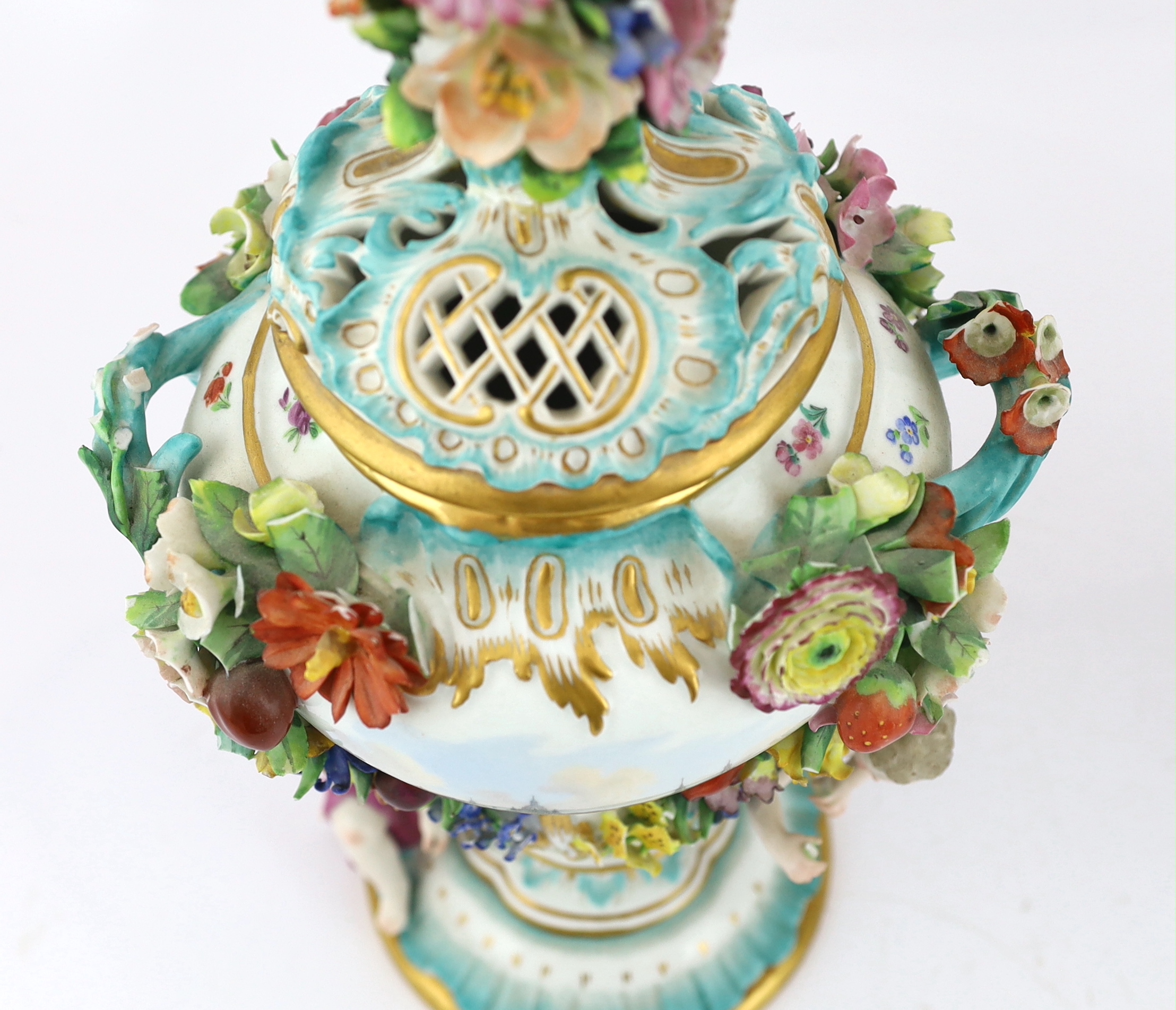 A pair of Meissen topographical flower encrusted vases and covers, 19th century, losses